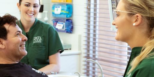 dentists with their male patient