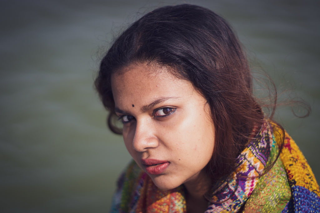 a woman wear colorful scarf