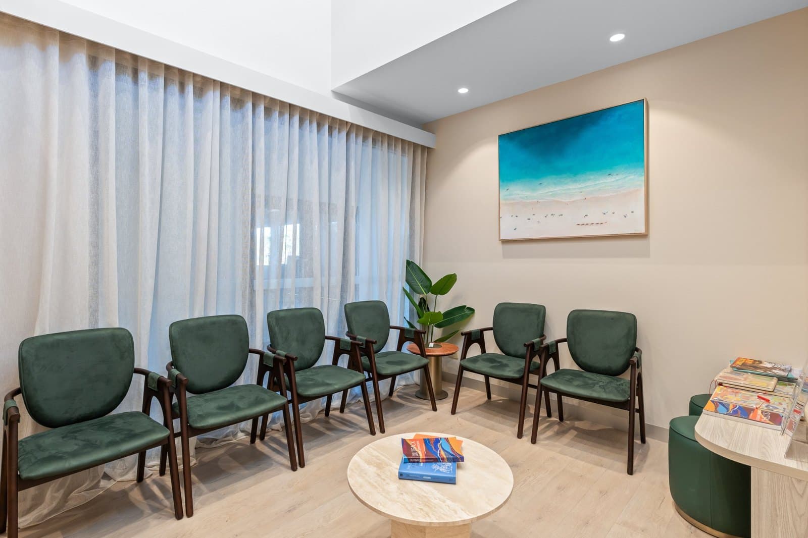 The waiting lounge at DNTL Code, with Gem Taylor’s beach painting above the chairs