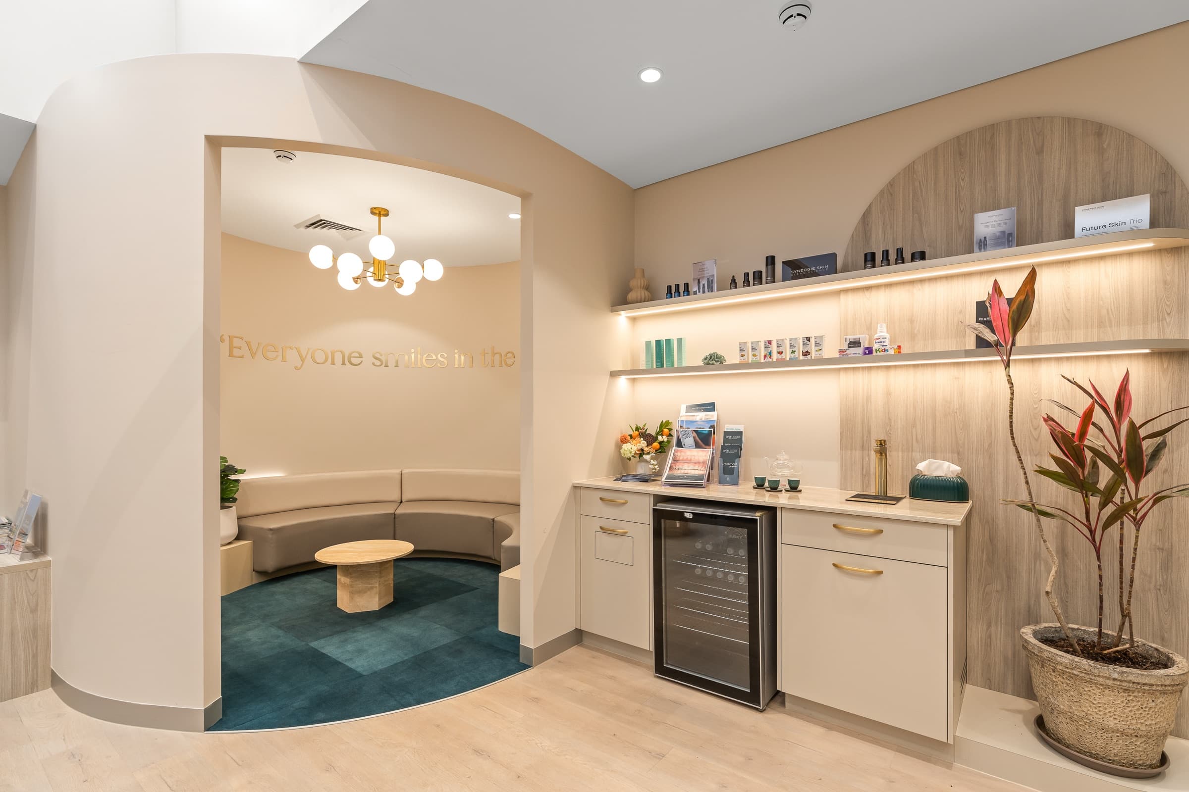 The DNTL Code skin lounge, with skincare shelves and a curved bench