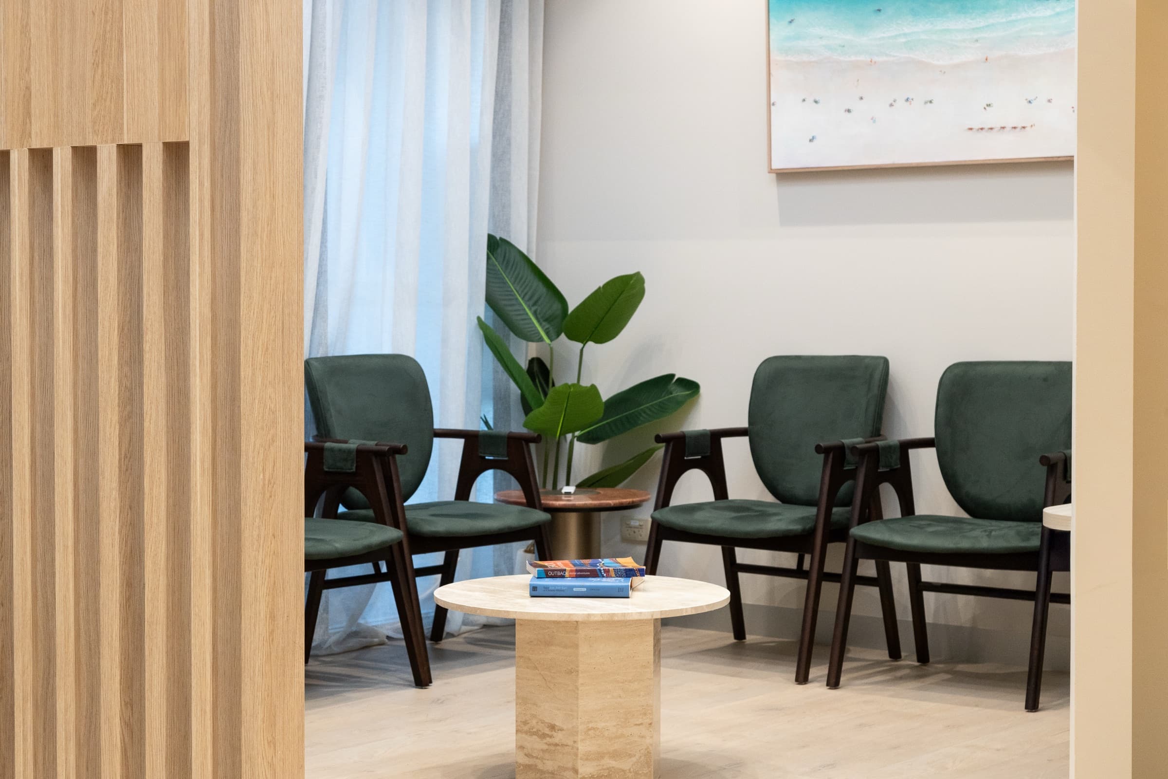 DNTL Code waiting room with green chairs and timber screens