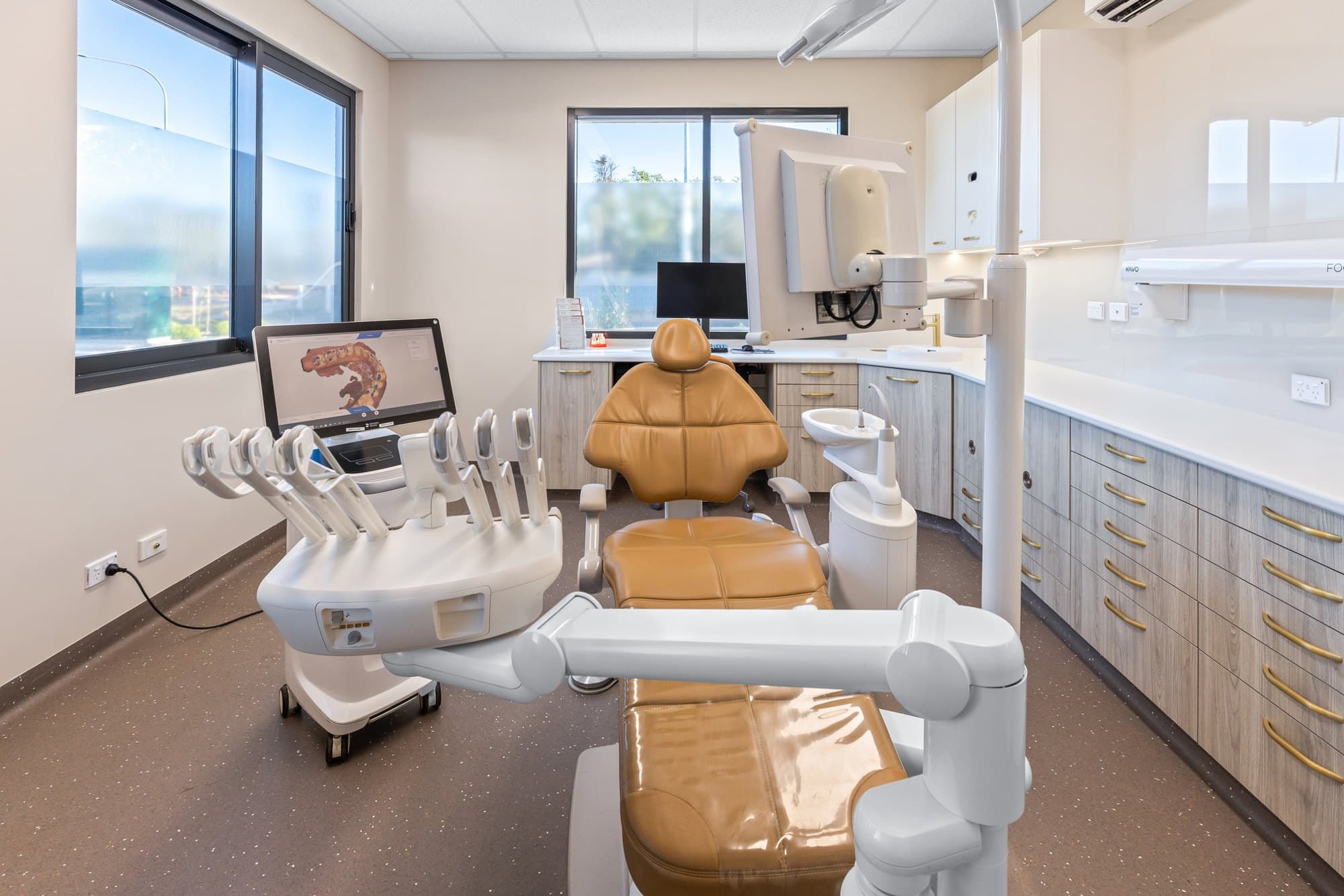 A DNTL Code dental surgery with a tan chair