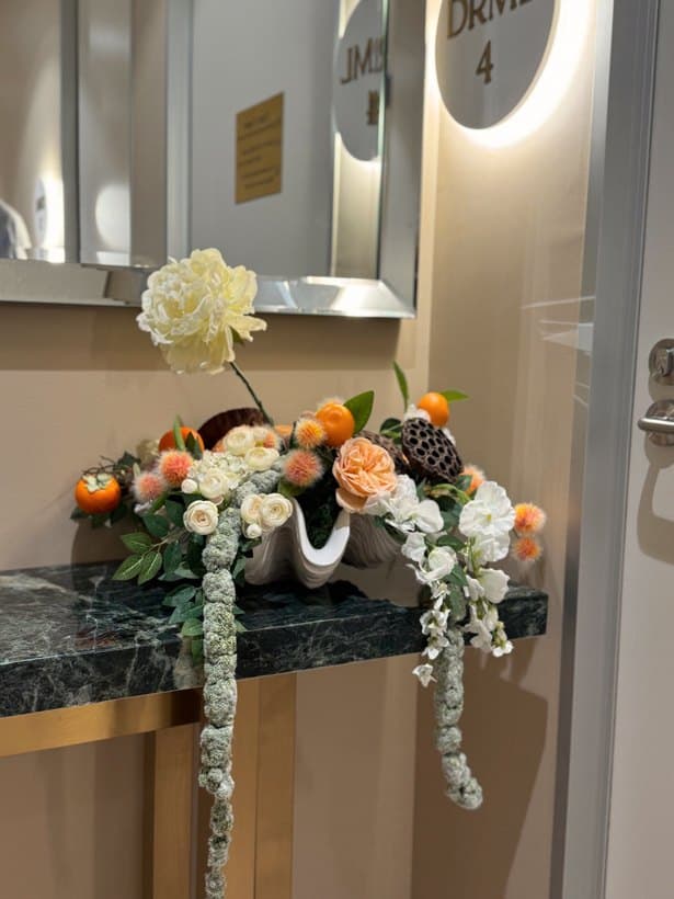 Flowers on green marble in the skin hallway