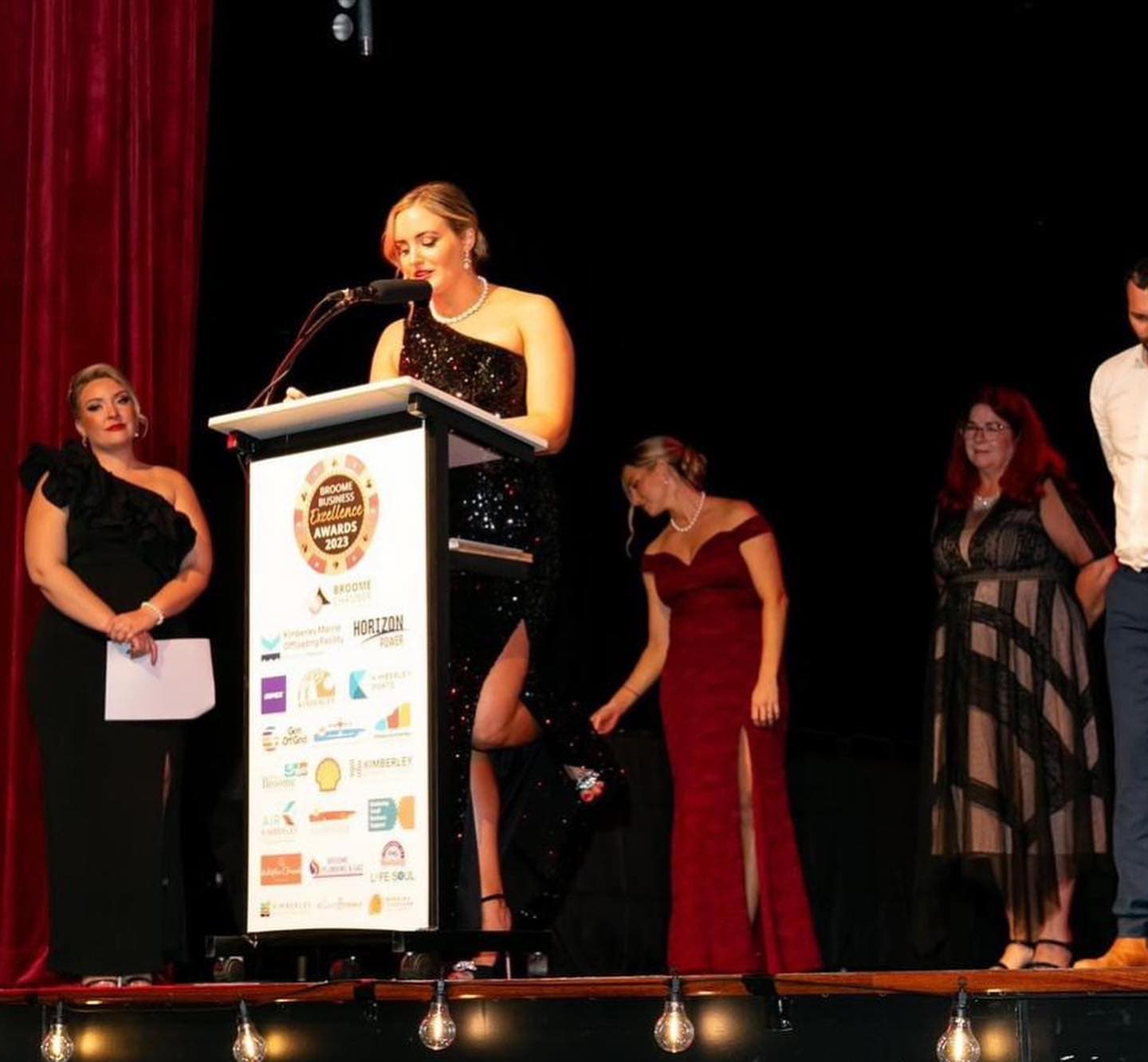 Speaker at a lectern at an awards ceremony
