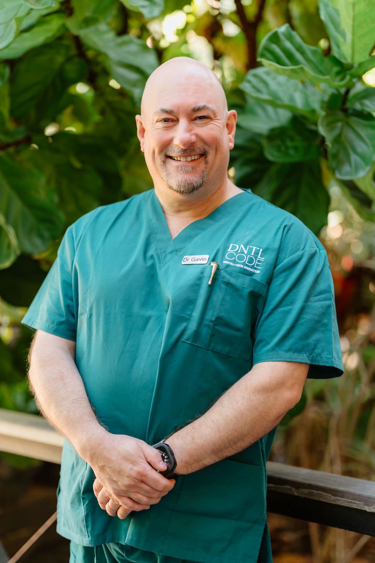 Dr Gavin Brown in teal scrubs