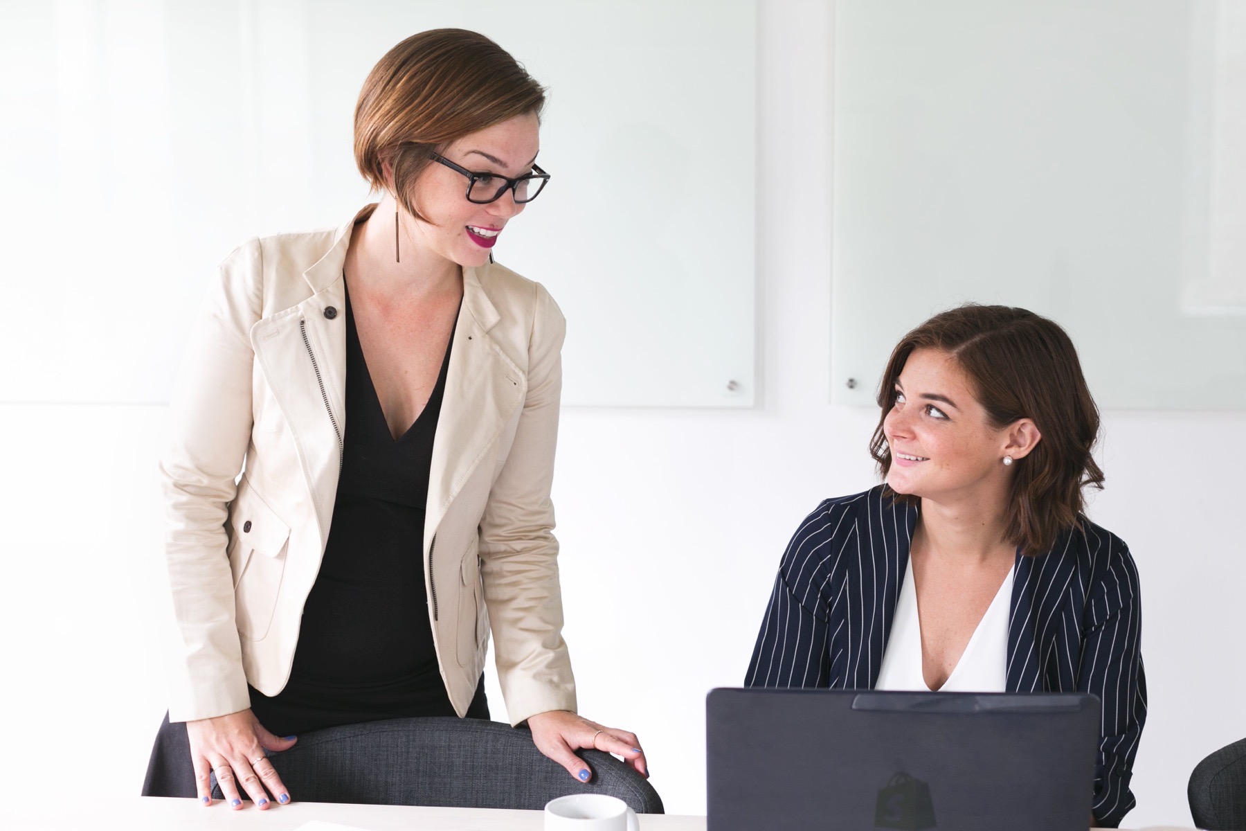 Two women talking in an office