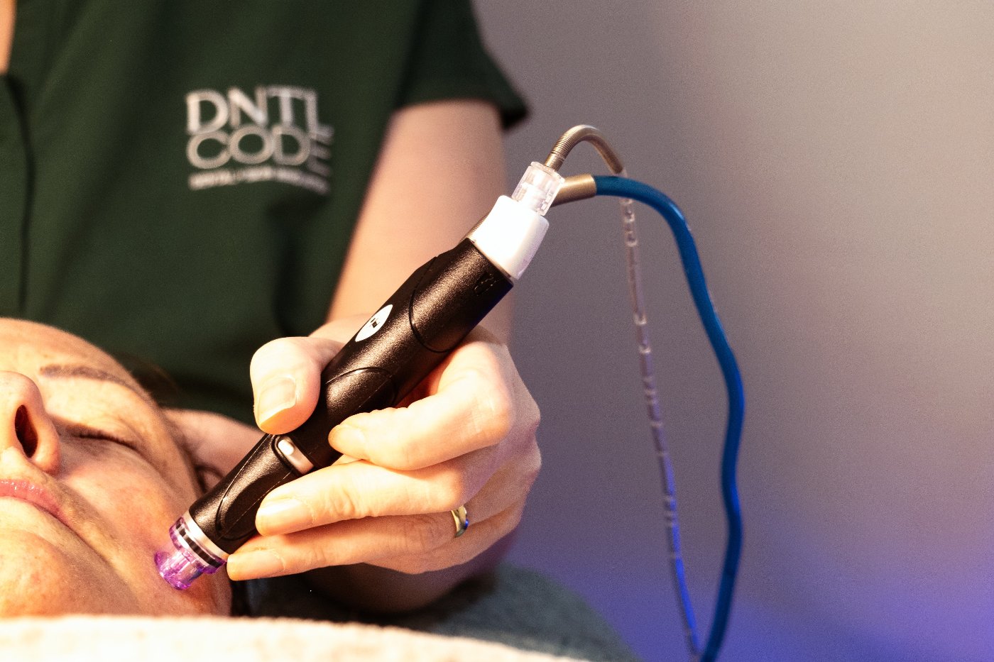 A girl doing hydra facial in dntl code clinic