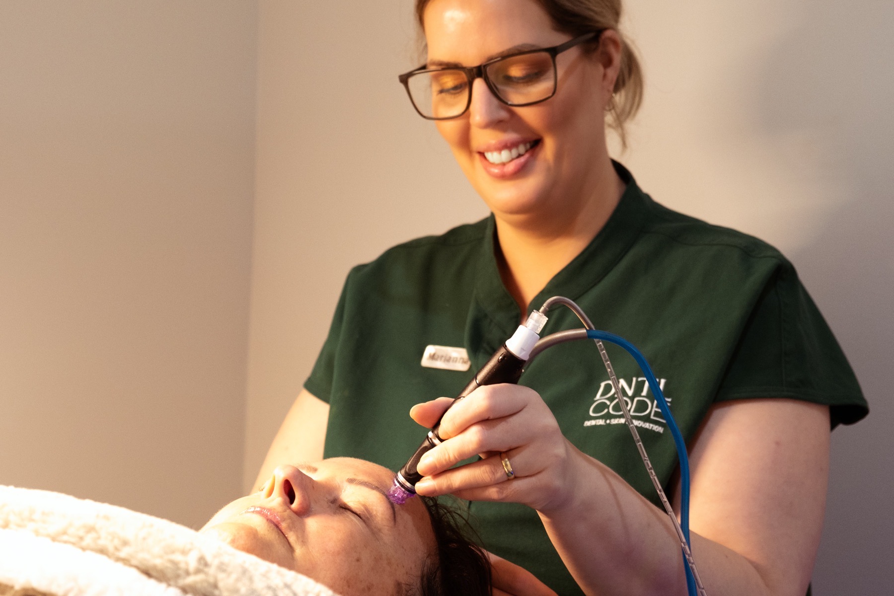 image of Dntl code staff doing facial treatment