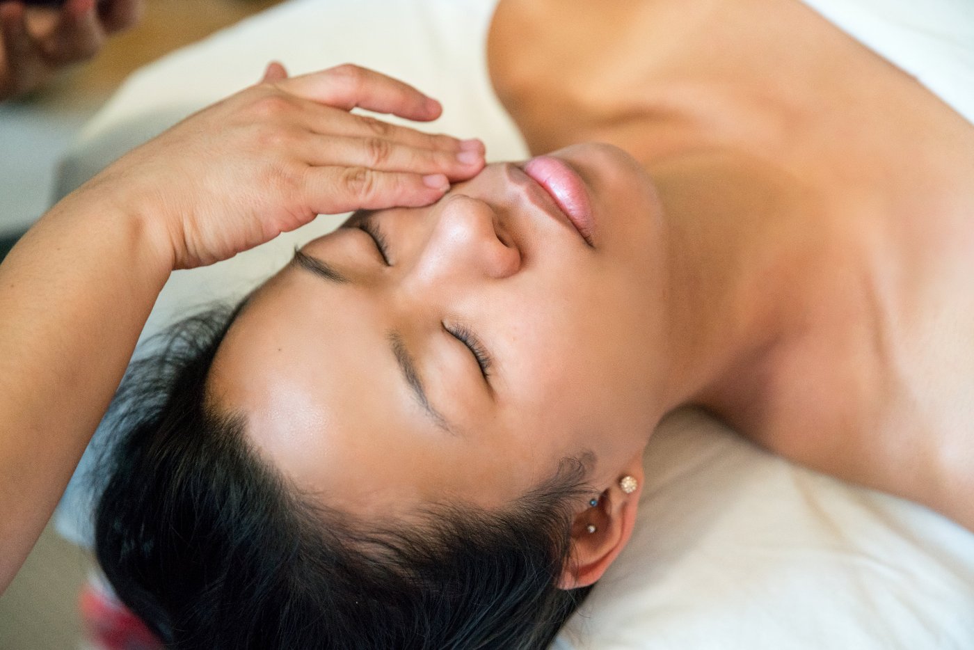 Woman receiving a facial massage