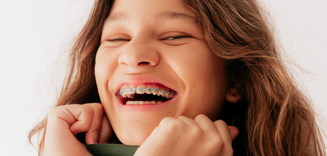 Laughing young person wearing braces